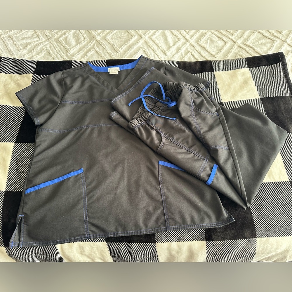 Scrubstar top and pants - black with royal blue stitching and trim.